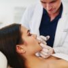 focused-doctor-doing-botox-injections-on-a-young-w